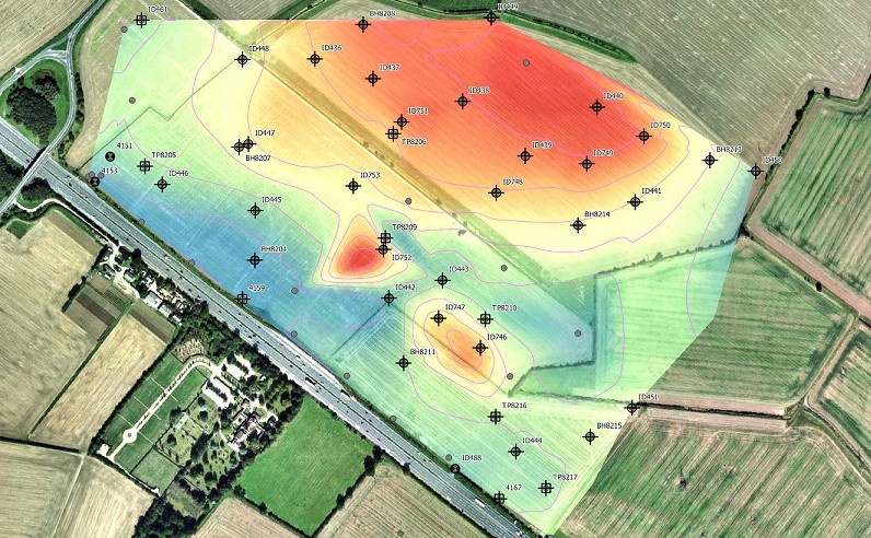 Aerial view of a color-coded field map showing different intensity levels, marked with black cross symbols and code labels. Created using GIS technology by Atkins, the map indicates areas of high (red) and low (blue) intensity within the field.