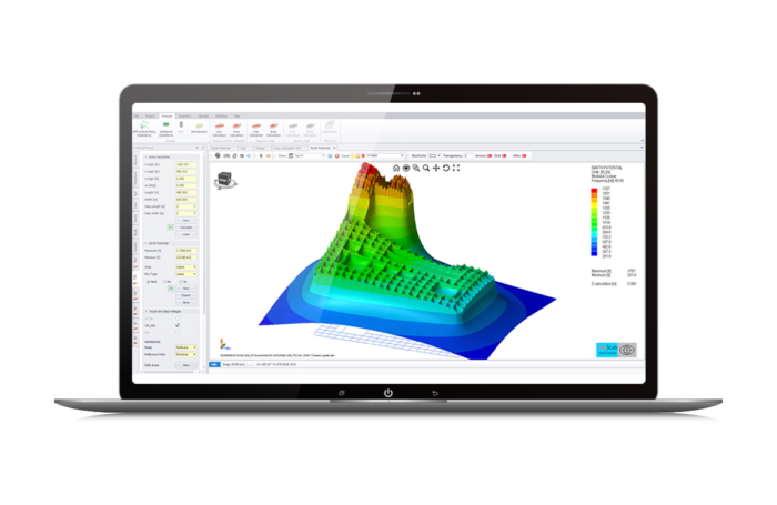 A laptop displaying a colorful 3D terrain or topographic model, with various data visualizations and analysis tools on the screen.