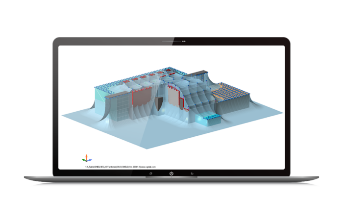 Écran d'un ordinateur portable affichant un modèle d'analyse structurelle 3D complexe avec différentes couleurs représentant divers niveaux de contrainte ou matériaux.