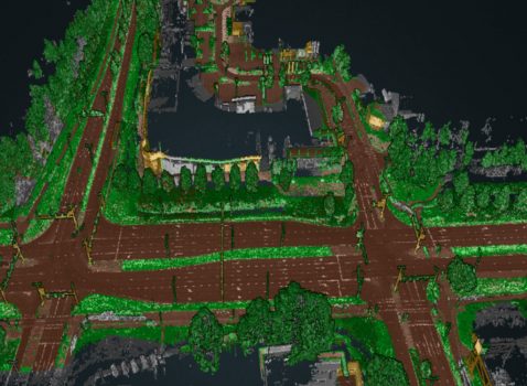 Aerial view of a digital map featuring roads and buildings in green and brown, depicting an urban area in the Netherlands with intersecting streets. Enhanced by AI-Infra Solutions, the map highlights the harmonious blend of infrastructure and surrounding vegetation.