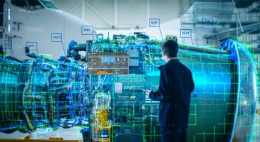 A person examines an aircraft engine with digital overlays and data points projected onto it, inside a hangar.