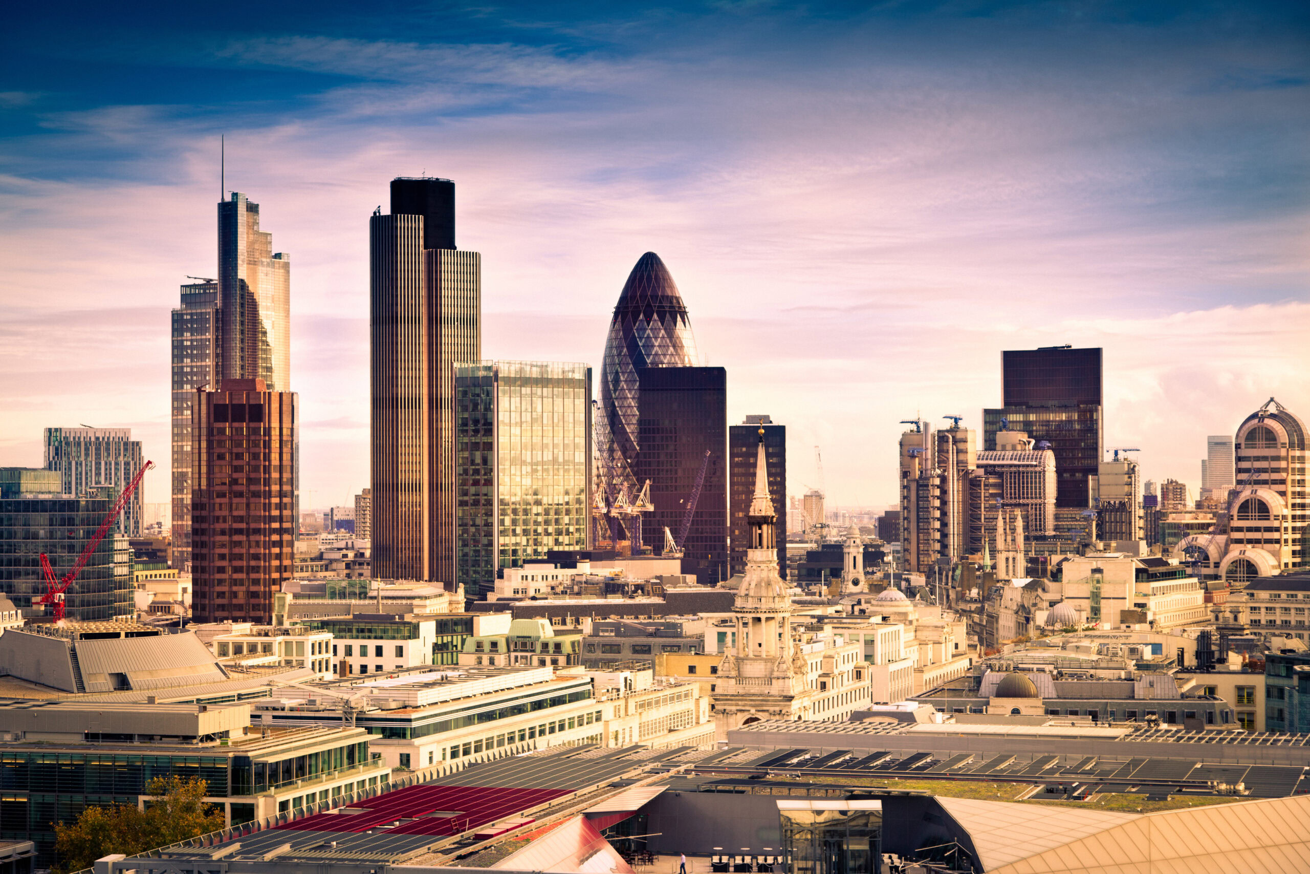 Financial district in London with 30 St Mary Axe tower ( the Gherkin ), the Heron Tower, Tower 42, Broadgate Tower in City of London Square Mile downtown.