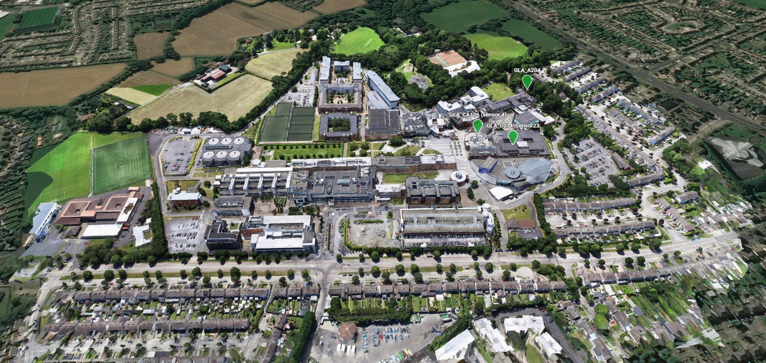 Aerial view of Dublin City University with numerous buildings, green spaces, and surrounding residential areas showcasing Smart City Innovations.