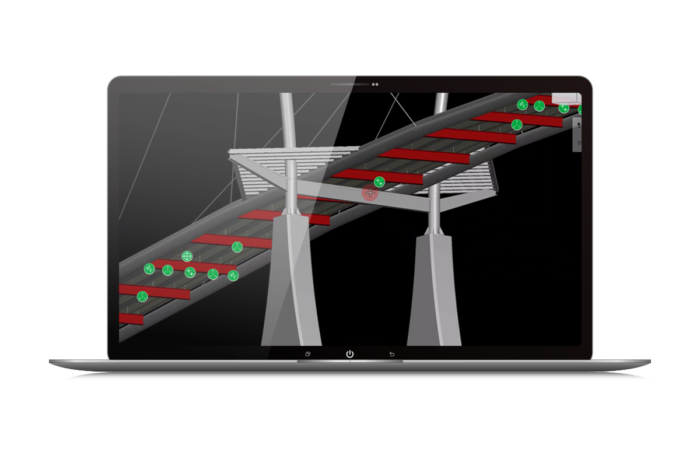 Ein computergeneriertes Rendering einer Brücke mit roten und grünen digitalen Markierungen, die wichtige Bereiche der Brücke hervorheben