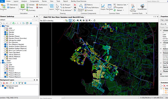 The computer screen displays a geographic information system (GIS) software interface, featuring a detailed map and tools for analysis and editing. This powerful tool encourages action towards sustainability by enabling precise environmental planning and efficient resource management.