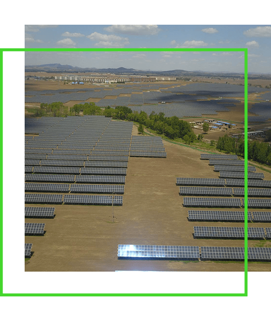 An aerial view of a solar panel field.