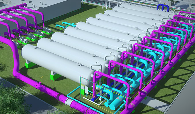 Vista de cima para baixo de uma instalação industrial com uma série de grandes tanques cilíndricos conectados por tubos coloridos em tons de roxo, azul e verde.