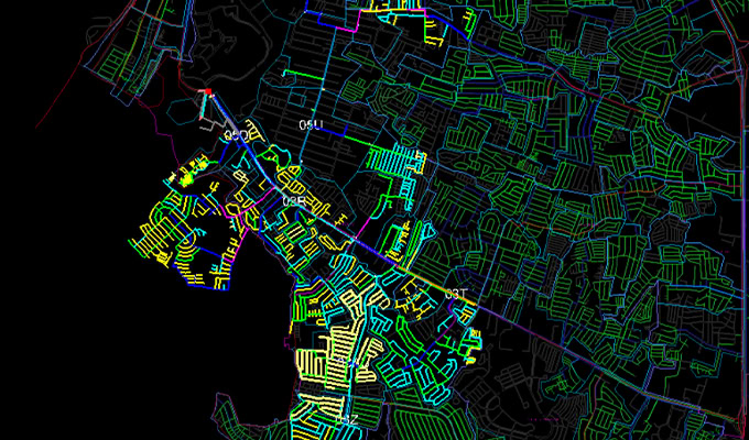 Una mappa dettagliata che mostra complessi layout stradali e territoriali, con varie regioni evidenziate in colori diversi su sfondo nero.